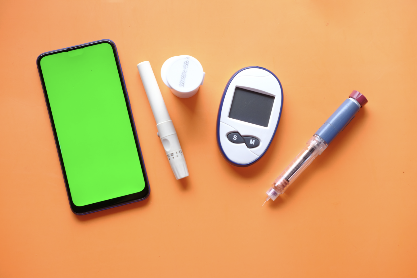 white and blue click pen beside teal tablet computer